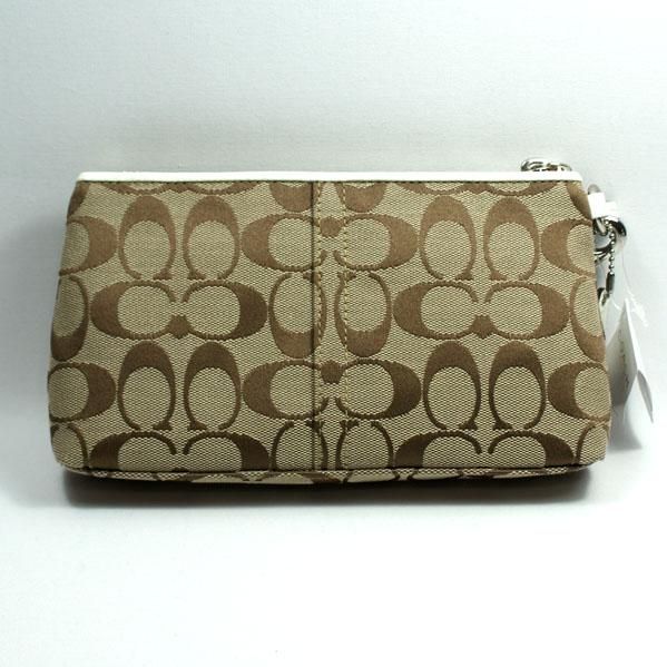 white wristlet clutch bag